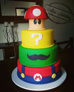 this is a cake made to look like mario mushroom and question mark on top of each other