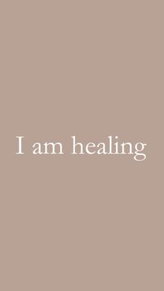 the words i am healing in white on a brown background