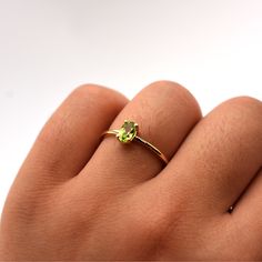 Details: Metal: Available in 14k White, Yellow, and Rose Gold Stone: 6mm x 4mm Natural Peridot Size: Available from Size 4 to Size 9 All Diamonds and Gemstones Are Responsibly and Ethically Sourced Peridot Ring Gold, Jewelry Staples, Peridot Jewelry, 14k Rose Gold Ring, Jewelry Picture, Authentic Jewelry, Peridot Ring, Amethyst Jewelry, Gold Stone