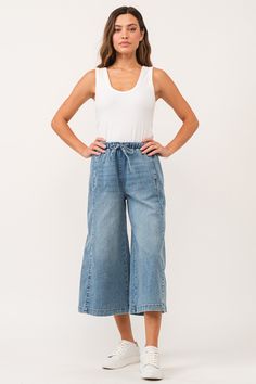 image of a female model wearing a ELINA SUPER HIGH RISE CROPPED WIDE LEG PANTS WINETOP CHAMBRAY DEAR JOHN DENIM Casual Medium Wash Wide-leg Cropped Jeans, Casual Wide-leg Cropped Jeans For Spring, Spring Wide Leg Culottes With Elastic Waistband, Casual Spring Wide-leg Cropped Jeans, Medium Wash Cropped Leg Bottoms For Spring, Summer Medium Wash Relaxed Fit Wide Leg Pants, Summer Relaxed Fit Medium Wash Wide Leg Pants, Spring Medium Wash Cropped Bottoms, Summer Wide Leg Pants In Medium Wash