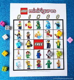 the lego minifigures bingo game is displayed on a blue surface with toy blocks