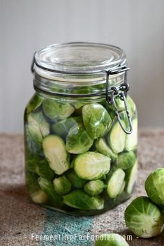 pickled and fermented brussel sprouts in a glass jar