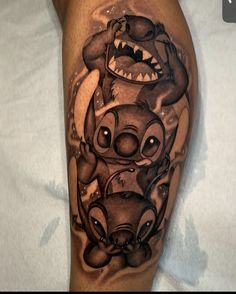 an arm with some cartoon characters on it