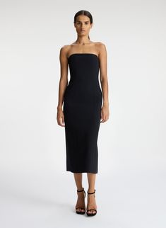 The Elizabeth Dress, a part of A.L.C.'s Signature Collection, is impeccably cut from matte black fabric. This tailored silhouette is strapless, featuring bone corsetry, pockets and darted seams for a feminine fit. Shop Dresses Styling Tip: Lean into '90s minimalism by pairing it with strappy stilettos and a small shoulder bag. Black Midi Dress Formal, 90s Minimalism, Strapless Sheath Dress, Midi Dress Formal, Strappy Stilettos, Black Strapless Dress, Strapless Midi Dress, Satin Midi Dress, Small Shoulder Bag