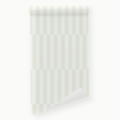 a white striped wallpaper with a corner cut out