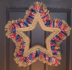 a star shaped wreath with red, white and blue decorations