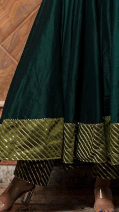 PRODUCT DESCRIPTION: Anarkali : Cotton silk Pant: Cotton silk Dupatta: Organza Color: Dark green work : Gotta lace work, allover anarkali ,pants and dupatta No. Of Components : Set of 3 Wash Care : Dry Clean Customization : Only Size and Length Of Product SKU#: 11403160GR Disclaimer: All our pieces are handcrafted in our manufacturing unit .We Ensure that our pieces are shot professionally under controlled lighting. Colours tend to be perceived differently depending on factors such as shot angle Dark Green Anarkali, Green Anarkali, Silk Anarkali Suits, Trendy Outfits Indian, Silk Anarkali, Outfits Indian, Anarkali Dress Pattern, Anarkali Kurta, Trendy Blouses