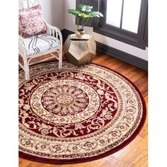 a living room area with a chair and rug