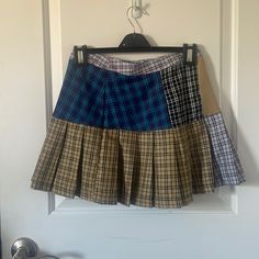 This Multicolored Skirt Is Super Cute And Has Never Even Been Worn! It’s In Great Condition! Casual Patchwork Flared Skirt Bottoms, Casual Patchwork Flared Skirt, Casual Patchwork Skirted Bottoms, Casual Tiered Skirt With Patchwork, Casual Tiered Patchwork Skirt, Trendy Mini Skirt With Patchwork, Relaxed Fit Multicolor Mini Skort, Trendy Multicolor Pleated Mini Skirt, Multicolor Tiered Skort With Lined Skirt