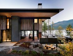 a modern house on the edge of a lake