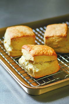 three biscuits sitting on top of a cooling rack