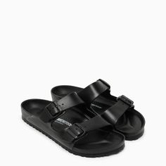 Black EVA rubber slide by Birkenstock, featuring round toe, strap with adjustable logo buckles, anatomically shaped EVA footbed and EVA rubber sole.100% Rubber / Rubber sole Birkenstock Arizona Eva, Arizona Eva, Birkenstock Black, Black Pvc, Birkenstock Arizona, Eva Sole, Winter Sale, Birkenstock, Fashion Designer