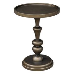 a round metal table with three balls on it's legs and an iron base