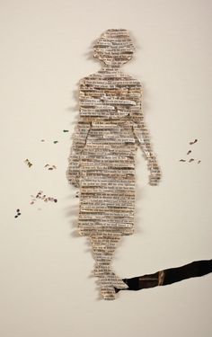 an altered photograph of a person made out of newspaper strips and torn up pieces of paper