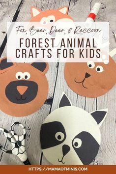 some paper animals that are on top of a wooden table with the words forest animal crafts for