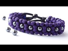 a purple bracelet with silver balls on it