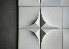 an abstract tile design in grey and white