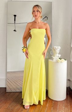 Yellow Strapless Maxi Dress  How to Style: This stunning vibrant strapless maxi () will have heads turn at your next event! Be a show stopper in the Myka! Elevate the look with gold dainty jewellery () and heels () for an elegant look.   Features:     * Maxi Length   * Light Weight Material   * Gripping around inner bust   * Invisible side zip (left side)   * Slight Stretch   * Strapless Long Yellow Dress, Yellow Strapless Dress, Dainty Jewellery, Prom Midi Dress, Beautiful Days, 60's Dress, Dress Off Shoulder, Strapless Maxi, Strapless Maxi Dress