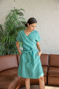 Linen wrap dress with 2 side pockets and slits On a photo- black, sapphire, amber- one size. Lagoon, Natural, Ocean green- S/M size.  One Size- ( US 6-14) S/M- ( for petite and US 2-4/6) - 100% European flax - pre-washed/pre-shrunk - medium weight linen - soft and comfortable - great texture and lovely wrinkles  FREE DOMESTIC SHIPPING ON ORDER $35+.RETURN DOMESTIC SHIPPING AND HANDLING FEE OF $4.99 WILL BE DEDUCTED FROM YOUR REFUND. Relaxed Fit V-neck Dress With Tie Waist, Blue Belted Wrap Dress, Blue Wrap Dress With Belt, Beach Short Sleeve Dresses With Side Pockets, Beach Dresses With Side Pockets And Short Sleeves, Beach Dress With Side Pockets And Short Sleeves, V-neck Dresses With Side Pockets And Relaxed Fit, Casual Green Wrap Dress, Green Short Sleeve Dress With Side Slits