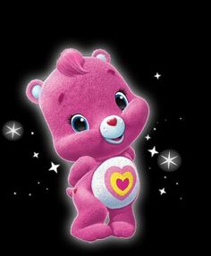 a pink teddy bear with a heart on its chest