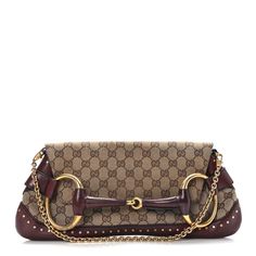 This is an authentic GUCCI Monogram Studded Horsebit Clutch in Bordeaux. This petite handbag is crafted of classic monogram GG canvas with wine red leather trim and a prominent leather covered gold-toned horsebit on the front. The bag features a gold-toned chain strap and crossover flap that tucks into the horsebit for added security. The flap opens to a brown fabric interior with a patch pocket. Gucci Evening Bag With Brass Hardware, Luxury Gucci Bag With Brass Hardware, Gucci Elegant Bag With Brass Hardware, Elegant Gucci Bag With Brass Hardware, Formal Monogram Canvas Bag With Horsebit Detail, Classic Gold Bag With Horsebit Detail, Elegant Bags With Horsebit Detail In Monogram Canvas, Luxury Gold Bag With Horsebit Detail, Luxury Gold Bags With Horsebit Detail