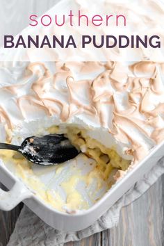 a banana pudding in a white casserole dish topped with whipped cream and a spoon