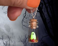 👻 Introducing our enchanting "Tiny Handcrafted Ghost in Bottle Necklace" - a bewitching accessory that captures the magic of the season!  🍂 Fall in love with this whimsical and delightful necklace that combines the charm of a miniature ghost with the beauty of autumn leaves. Handcrafted with love and attention to detail, this adorable glass bottle pendant is an absolute must-have for ghostly enthusiasts and nature lovers alike. 🌟Glow in the Dark Wonder: As the day turns to night, watch in won Handmade Magical Jewelry For Halloween, Cute Halloween Party Jewelry, Whimsical Halloween Jewelry Gift, Cute Handmade Halloween Jewelry, Ghost In Bottle, Dark Halloween Party, Ghost Bottle, Ghost In A Bottle, Pet Ghost