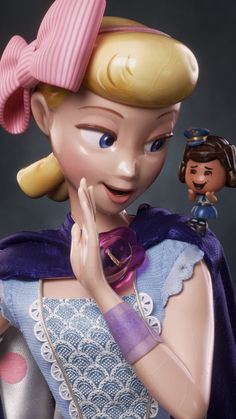 a close up of a figurine of a girl with a doll on her shoulder