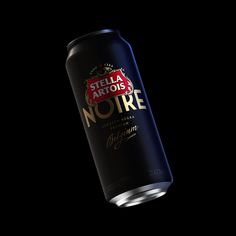 a can of beer on a black background with the words stellar artois noire