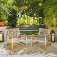 there are three chairs and two tables in the yard with potted plants behind them