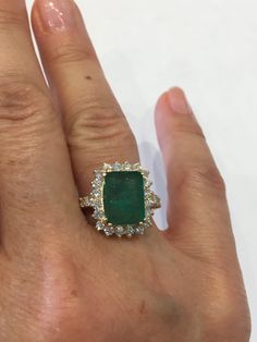 Solid 14K Yellow Gold Emerald Cut Genuine 4 ct Emerald Diamond Accent Ring Sz 7: Brand new with appraisal from certified gemologist We have managed to secure some amazing vintage estate Jewelry such as this gorgeous ring which displays all of the quality of the 1980s. This includes 14K Gold, natural Emerald & Diamonds, and beautiful craftsmanship. Please be sure to see our other listings for more of these great vintage rings in different sizes and styles. Wow..Over 4 carats of genuine Emeral Gia Certified Yellow Gold Emerald Ring For Formal Occasions, Formal Gia Certified Yellow Gold Emerald Ring, Gia Certified Emerald-cut Halo Ring For Formal Occasions, Formal Green Gia Certified Cluster Ring, Gia Certified Yellow Gold Emerald Cut Halo Ring, Gia Certified Emerald Cut Yellow Gold Halo Ring, Gia Certified Cushion Cut Emerald Ring For Anniversary, Gia Certified Cushion Cut Emerald Anniversary Ring, Gia Certified Emerald Ring In 14k Gold For Anniversary