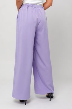 In a beautiful lavender color, these trousers feature a high-rise waistline, perfect for a sophisticated look. Model Info: Model is wearing a size small. True to size Height: 5'8" Bust: 32A Waist: 24" Hips: 34" Casual Lavender High Waist Pants, Chic Purple Solid Color Bottoms, Elegant High-waisted Purple Pants, Purple Full Length Formal Bottoms, Purple Formal Full-length Bottoms, Formal Purple Straight Pants, Purple Straight Pants For Formal Occasions, Full Length Purple Formal Bottoms, Trendy Purple Wide Leg Bottoms