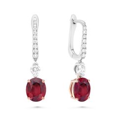 Perfect your attire with these stylish red ruby and diamond earrings. Crafted in 18K white and rose gold, each eye-catching design features a striking cushion-cut red ruby in a rose gold cat claw four-prong setting, topped by a round diamond hanging from a sparkling post. Radiant with 4ct. t.w. these spectacular drops suspend from English lock backs.
3.60 carat cushion cut natural red ruby
0.45 carat pave diamond setting
18k white and rose gold
The earring design can be custo Ruby Drop Earrings, Ruby And Diamond Earrings, Jewelry Gold Earrings, Ruby Birthstone, Tanzanite Earrings, Earrings Diamond, Ruby Earrings, Emerald Earrings, Earrings Wedding