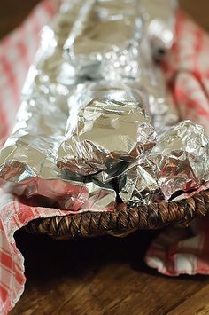 some tin foil sitting on top of a wooden table