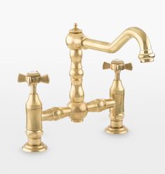 a golden faucet with two handles and nozzles on the side, against a white background