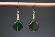 Emerald Green Earrings Czech Glass Earrings Dangle Drop Earrings Gift for women Color : Emerald Green diamond round Czech glass beads Finish : Antiqued brass findings Size : Approx 1-3/4 inches including the antique brass lever back Ear wires : Antique Brass lever back Czech Glass Earrings : https://www.etsy.com/shop/NtikArtJewelry?ref=hdr_shop_menu§ion_id=16062218 Thanks for looking Elegant Czech Glass Round Beaded Earrings, Elegant Round Beaded Earrings With Czech Glass, Elegant Round Czech Glass Beaded Earrings, Elegant Czech Glass Round Earrings, Green Metal Round Bead Earrings, Skull Jewelry Women, Buy Earrings Online, Tiffany And Co Necklace, Emerald Green Earrings