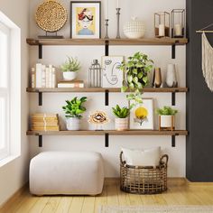 a living room with shelves filled with plants and pictures