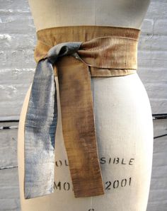 "This modern interpretation of an obi sash is made in reversible silk shantung. Shown in bronze reversing to pewter solid shantung. The sash provides an instant update to your wardrobe - add to a basic black dress or pair it with a tunic tee and jeans. It can be worn wrapped and tied in the front (as shown) or tied in the back. It's the ultimate must-have accessory! Widest part approx. 3 1/2\" Tie ends approx. 2 1/4\" Available in 3 lengths: 80\" long - fit up to a 32\" waist when wrapped & Obi Sash, Basic Black Dress, Vintage Slip Dress, Vintage Slips, Ball Gown Skirt, Prom Outfits, Suspender Belt, Sewing Clothes, Black Silk