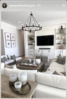 a living room filled with furniture and a flat screen tv mounted to the side of a wall