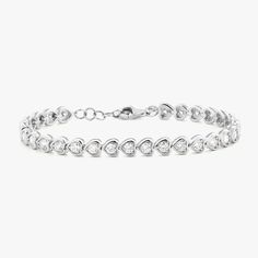 Heads will turn when wearing the exquisite Harley Diamond Tennis Bracelet. A unique take on a classic tennis bracelet, this stunning style is a must have! Metal: 14k White Gold / 14k Yellow Gold Round Brilliant Cut Natural Diamonds: Approx. 2.17 ctw G/H Color and SI1-2 Clarity Diamonds Length: 7 inches at the longest Features 6 inches of bezeled diamonds + 1 inch of jump rings for versatile wear between 6"-7" Closure: Lobster clasp Looking for a different size? Please email us. Diamond Heart Cut Tennis Bracelet With Brilliant Cut, Luxury Heart Cut Cubic Zirconia Tennis Bracelet, Luxury Cubic Zirconia Heart Cut Tennis Bracelet, Fine Jewelry White Gold Heart Bracelet With Cubic Zirconia, Elegant Heart-shaped Brilliant Cut Diamond Bracelet, Classic Diamond Heart Bracelet In White Gold, Classic White Gold Diamond Heart Bracelet, Classic Heart Cut Tennis Bracelet For Formal Occasions, White Gold Diamond Heart Bracelet