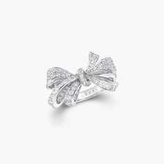 Featuring a playful bow motif set with round and baguette cut diamonds, our charming ring from the Tilda’s Bow collection captures the beauty of a silk bow, freshly tied by hand. Recreated in shimmering rows of diamonds set in white gold, each of the baguette cut stones has been individually cut by hand to fit the delicate curves of the design. An enduring influence on the House of Graff, our latest, entirely lifelike interpretation of the bow has inspired a whole collection of jewels, including Diamond Bow Jewelry For Weddings, Elegant Diamond Rings With Bow Detail, Elegant Diamond Jewelry With Bow Detail, Luxury Diamond Bow Jewelry, Luxury Bow Jewelry For Anniversary, White Gold Bow Rings For Wedding, Graff Diamonds, Classic Diamond Ring, Diamond Drop Pendant