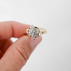 Add a touch of vintage glamour to your ensemble with our exquisite 10K Yellow Gold Diamond Cluster Vintage Cocktail Ring. Crafted with meticulous attention to detail, this ring features a dazzling cluster of diamonds set in luxurious 10K yellow gold. Shank size: 1.8 mmHead size: 14 mmRing size: 7.75Diamonds: 8 x 0.005Ctw = 0.08CtwColor And Clarity: H-I/I1Weight: 2.5g(Complimentary resizing available. For more information, please contact us via message.)For more of our jewelry products, please vi Diamond Cluster Ring In Fine Jewelry Style, Classic 14k Gold Cluster Diamond Ring, 14k Gold Cluster Diamond Ring Fine Jewelry, Cluster 14k Gold Diamond Ring For Anniversary, Yellow Gold Cluster Promise Ring, 14k Gold Cluster Diamond Ring For Anniversary, Yellow Gold Cluster Ring For Promise, Yellow Gold Diamond Cluster Ring For Anniversary, Yellow Gold Cluster Diamond Ring For Anniversary