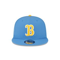 The UCLA Bruins 9FIFTY Snapback features an embroidered Bruins logo at the front panels with a team wordmark above an adjustable snapback closure at the rear and a yellow undervisor. Bruins Logo, World Baseball Classic, Ucla Bruins, New Era 59fifty, Oakland Athletics, Blue Jays, Detroit Tigers, Philadelphia Phillies, Texas Rangers