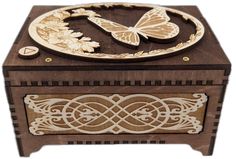 a wooden box with an intricate design on the front and sides, decorated with butterflies