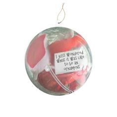 a glass ornament with a message on it