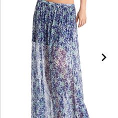 Style: #P21d2202000 Capture Two Of-The-Moment Trends In This Floral Maxi Skirt. Its Chic Length And Eye-Catching Pattern Keep Your Style Current And Ready For Summer. Maxi Skirt Sheer Floral Pattern Miniskirt Length Lining Hidden Zipper Closure At Side Measures 40” Length From Waist To Hem 100% Viscose. Lining: 96% Polyester, 4% Spandex. Dry Clean Note: Tags Have Been Cut Through To Prevent Store Returns Blue Floral Print Long Skirt, Blue Floral Print Maxi Skirt For The Beach, Chic Blue Skirt With Elastic Waistband, Chic Blue Maxi Skirt With Floral Print, Blue Maxi Skirt For Vacation, Blue Flowy Maxi Skirt For Day Out, Blue Summer Skirt With Elastic Waistband, Blue Casual Maxi Skirt With Elastic Waistband, Blue Maxi Skirt With Elastic Waistband For Vacation