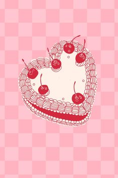 a heart shaped cake with cherries on it