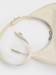 with Colour:  Cream Size:  M IN STOCK M An updated take on our much-coveted Gabine saddle bag has brought the style back into our hearts this fall. Available in a slew of new colourways — including cream, dark green, mustard, and signature black — this gorgeous medium-sized carryall features the much-loved classic curved-bottom silhouette and gold-tone buckle accent. The secret of its success lies in its carrying versatility: it can be clutched, held in-hand, or worn over the shoulder (with t Yoyo Cao, Moon Silhouette, Spool Heel, Charles Keith, Pretty Bags, Hobo Bag, Saddle, Saddle Bags, Pumps Heels