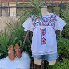 Embroidered White Top. Can Be Worn Oversized Multicolor Embroidered Top With Hem For Vacation, Multicolor Embroidered Top With Embroidered Hem For Spring, Vacation Multicolor Embroidered Top With Hem Detail, Multicolor Embroidered Top With Hem Detail For Spring, Spring White Blouse With Tonal Embroidery, White Blouse With Tonal Embroidery For Spring, Spring Embroidered Top With Geometric Multicolor Embroidery, Multicolor Intricate Embroidery Top For Vacation, Summer White Blouse With Tonal Embroidery