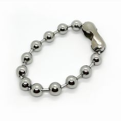 This beautiful two tone chunky ball bead Bracelet is ideal to create your arm candy to give a beautiful and elegant look. This bracelet comes with a weld and with an extender. You can wear them alone or combine it with different tones. This is an ideal piece to elevate your outfit look. Jewelry comes in a Pouch. Bracelet Details: Material: Water resistant Length: 7' Inch Thickness: 10mm Quantity: 1 Chain Color: Silver Does not tarnish/change color overtime Check Our Jewelry Care Instructions. Fa Metal Bracelets With Round Beads For Everyday, Everyday Metal Bracelets With Round Beads, Everyday Ball Chain Bracelet, Silver Beaded Ball Chain Bracelet, Metal Ball Chain Bracelet, Metal Bracelets With Round Beads And Extender, Adjustable Metal Ball Chain Bracelet, Metal Beaded Bracelets With Round Beads, Nickel-free Metal Bracelets With Round Beads